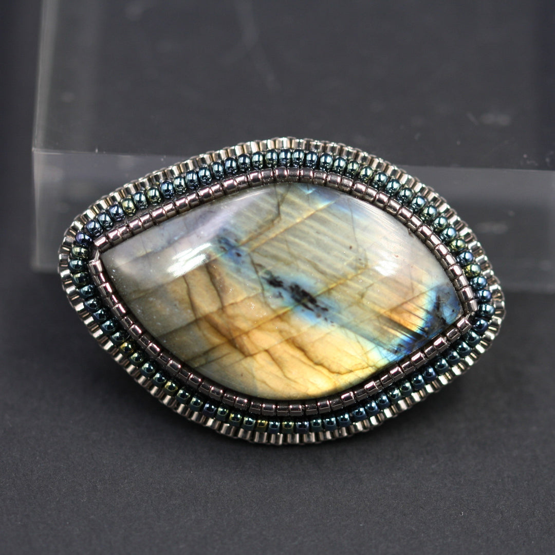 Embroidered brooch, labradorite