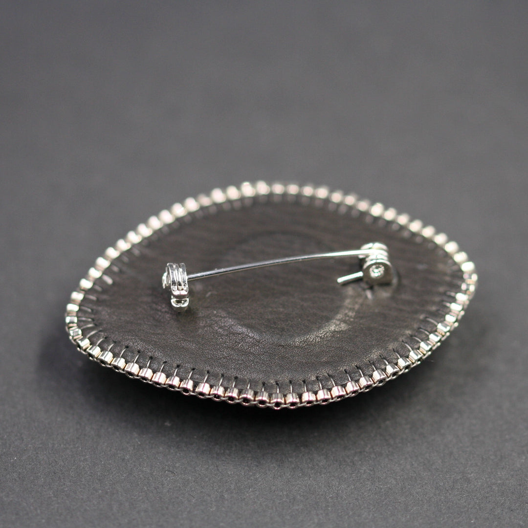 Embroidered brooch, labradorite