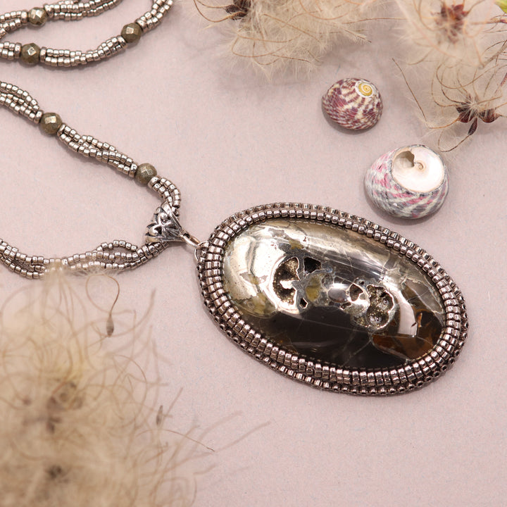 Necklace with pyritized ammonite and yellow calcite