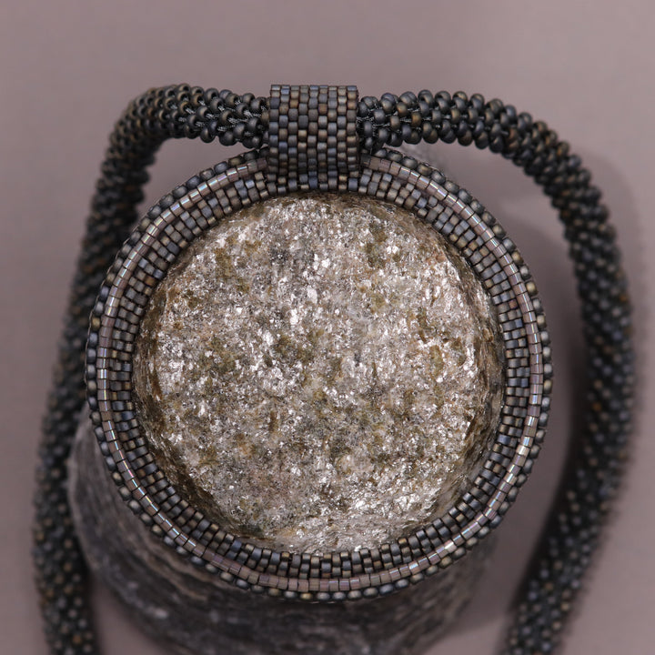 Embroidered necklace with micaschist (mica and garnet)