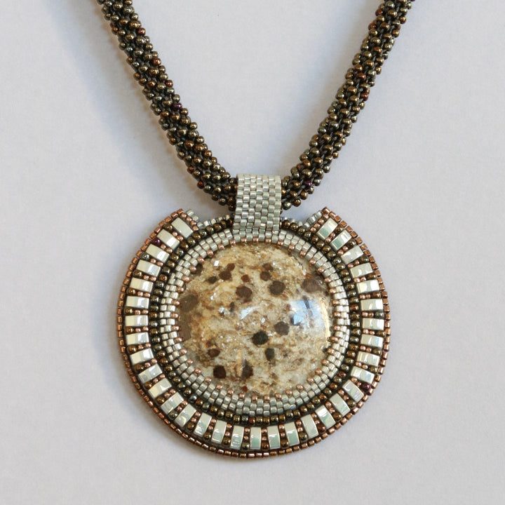 Embroidered necklace with micaschist (mica and garnet)