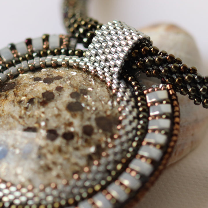 Embroidered necklace with micaschist (mica and garnet)