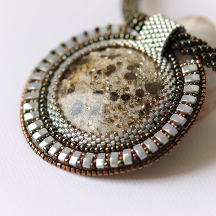 Embroidered necklace with micaschist (mica and garnet)