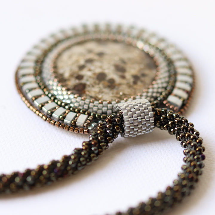 Embroidered necklace with micaschist (mica and garnet)