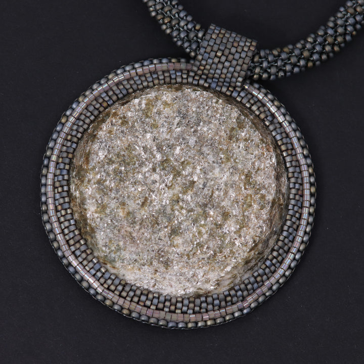 Embroidered necklace with micaschist (mica and garnet)