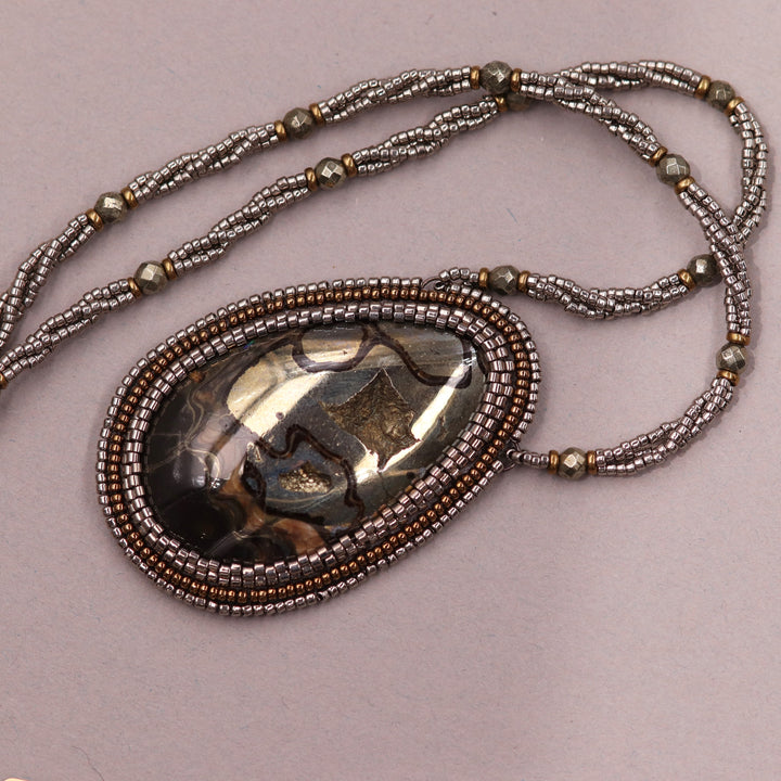 Necklace with pyritized ammonite, yellow calcite