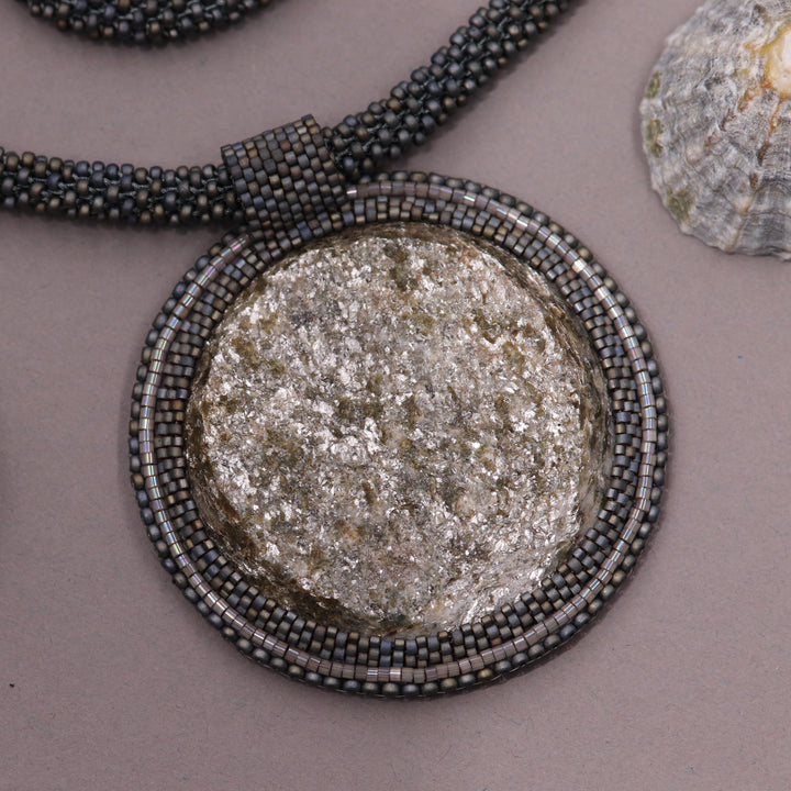 Embroidered necklace with micaschist (mica and garnet)