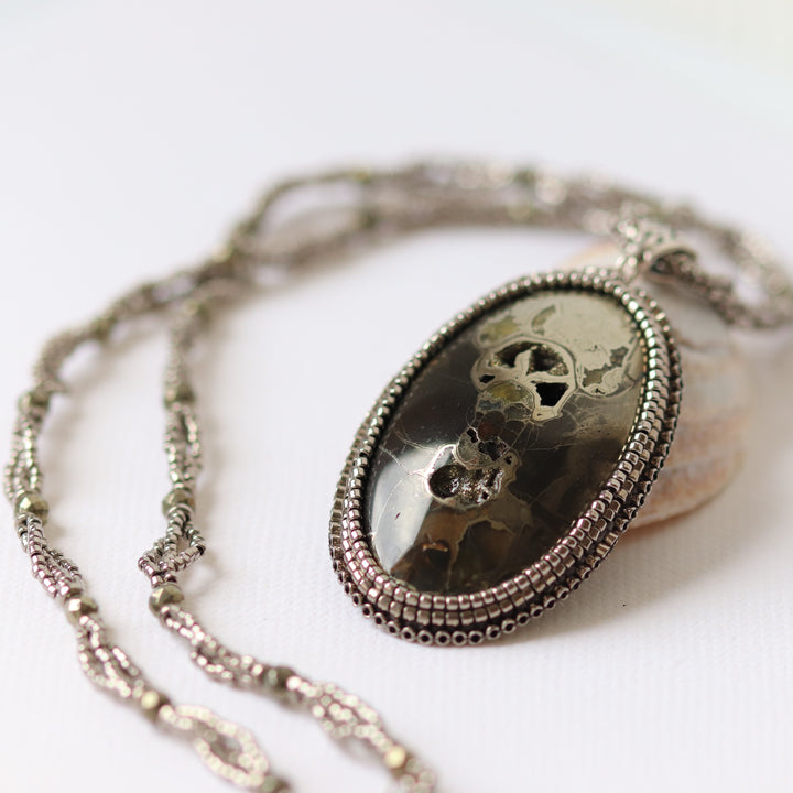 Necklace with pyritized ammonite and yellow calcite