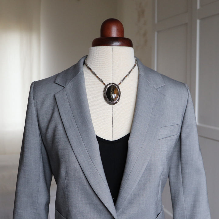 Necklace with pyritized ammonite and yellow calcite