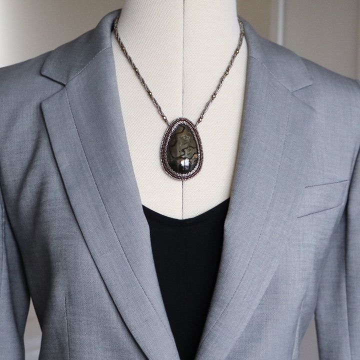 Necklace with pyritized ammonite, yellow calcite