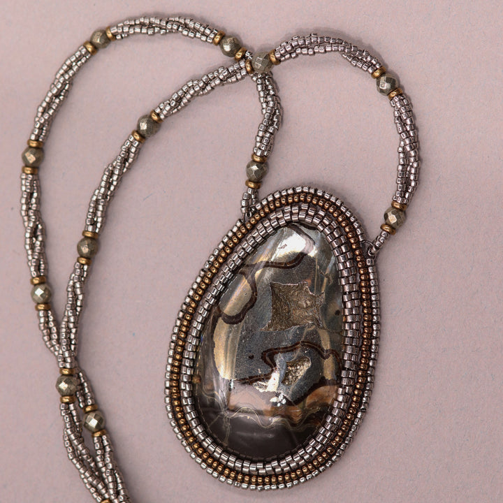 Necklace with pyritized ammonite, yellow calcite