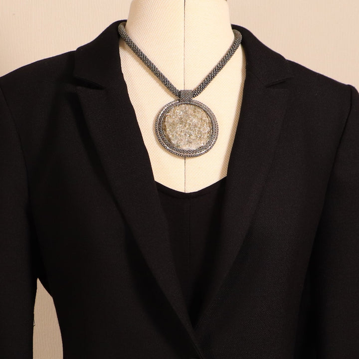 Embroidered necklace with micaschist (mica and garnet)