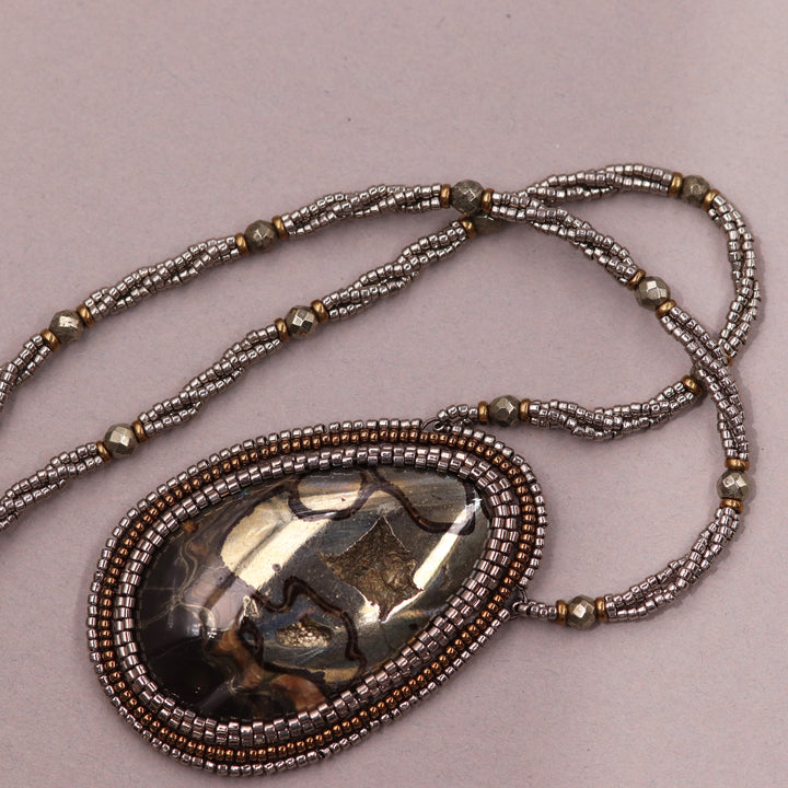 Necklace with pyritized ammonite, yellow calcite