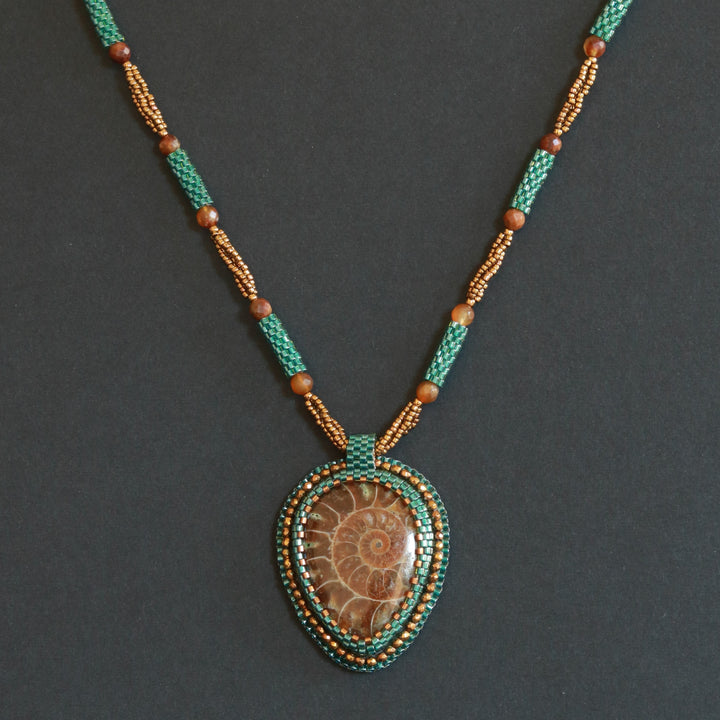 Embroidered necklace with ammonite and pyrite