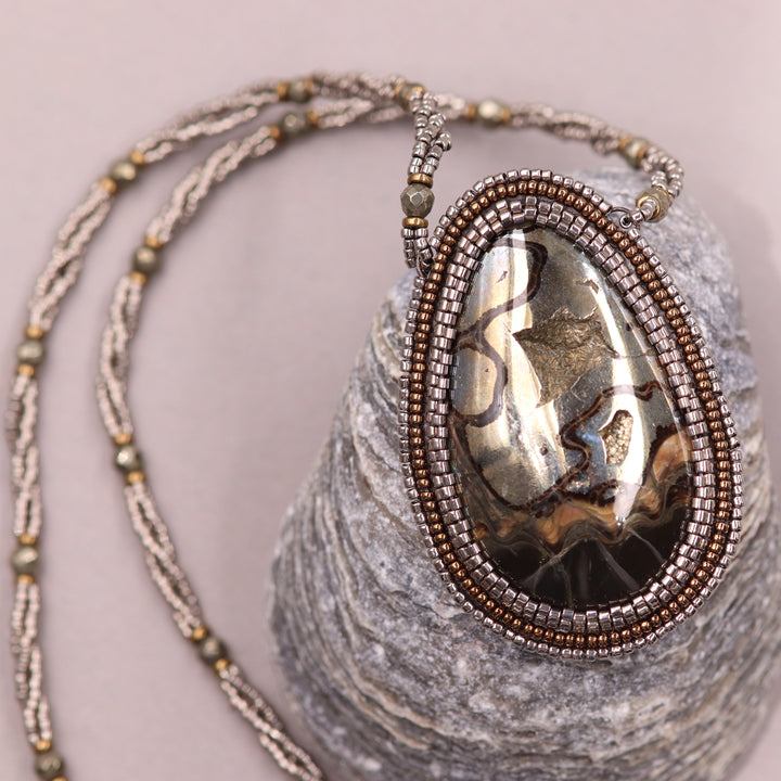 Necklace with pyritized ammonite, yellow calcite