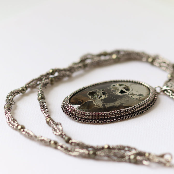 Necklace with pyritized ammonite and yellow calcite