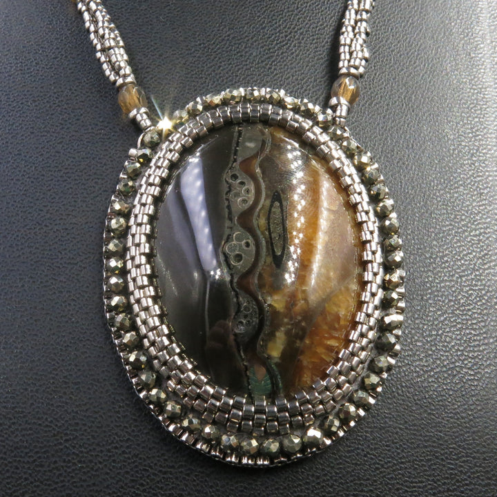 Necklace with pyritized ammonite and yellow calcite
