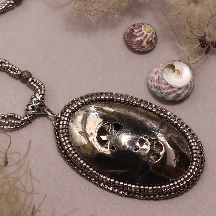 Necklace with pyritized ammonite and yellow calcite