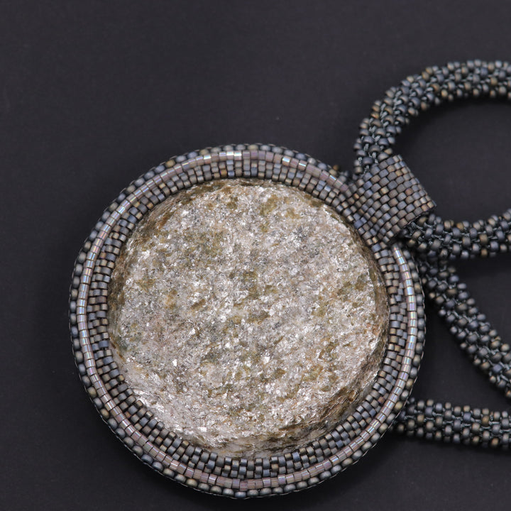 Embroidered necklace with micaschist (mica and garnet)