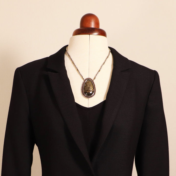 Necklace with pyritized ammonite, yellow calcite