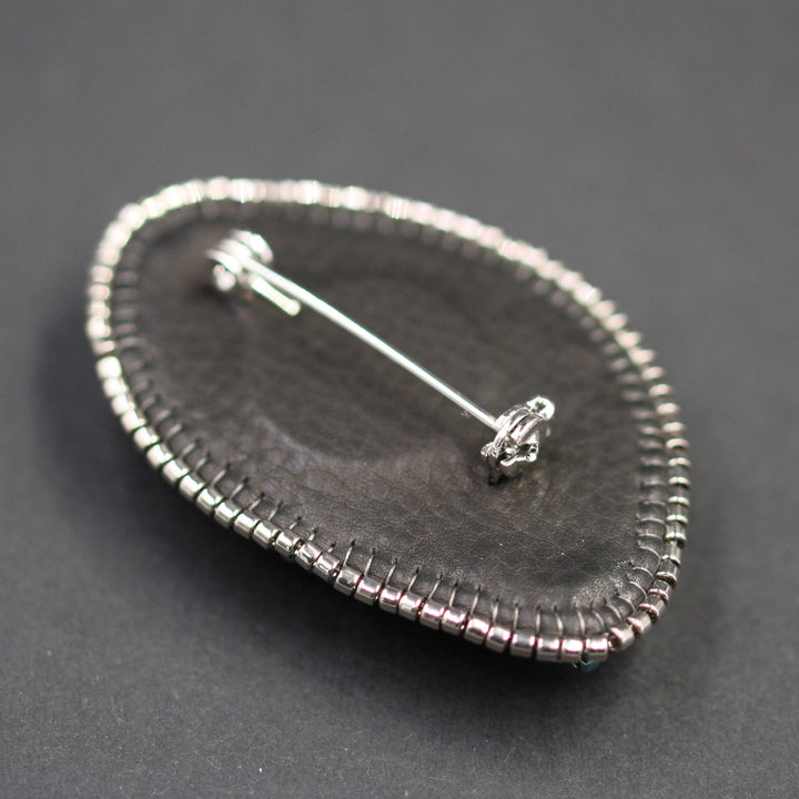 Embroidered brooch, labradorite