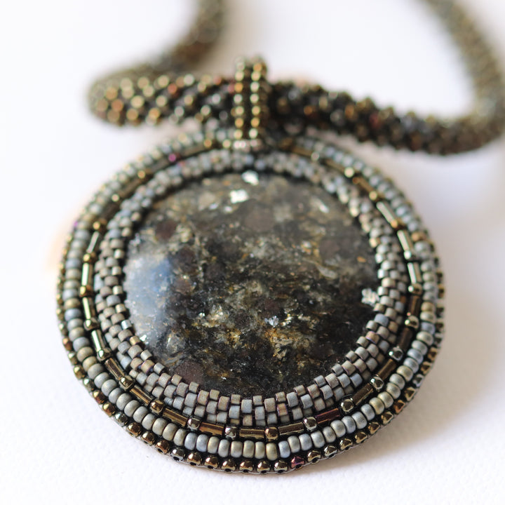 Embroidered necklace with micaschist (mica and garnet)