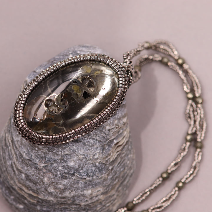 Necklace with pyritized ammonite and yellow calcite