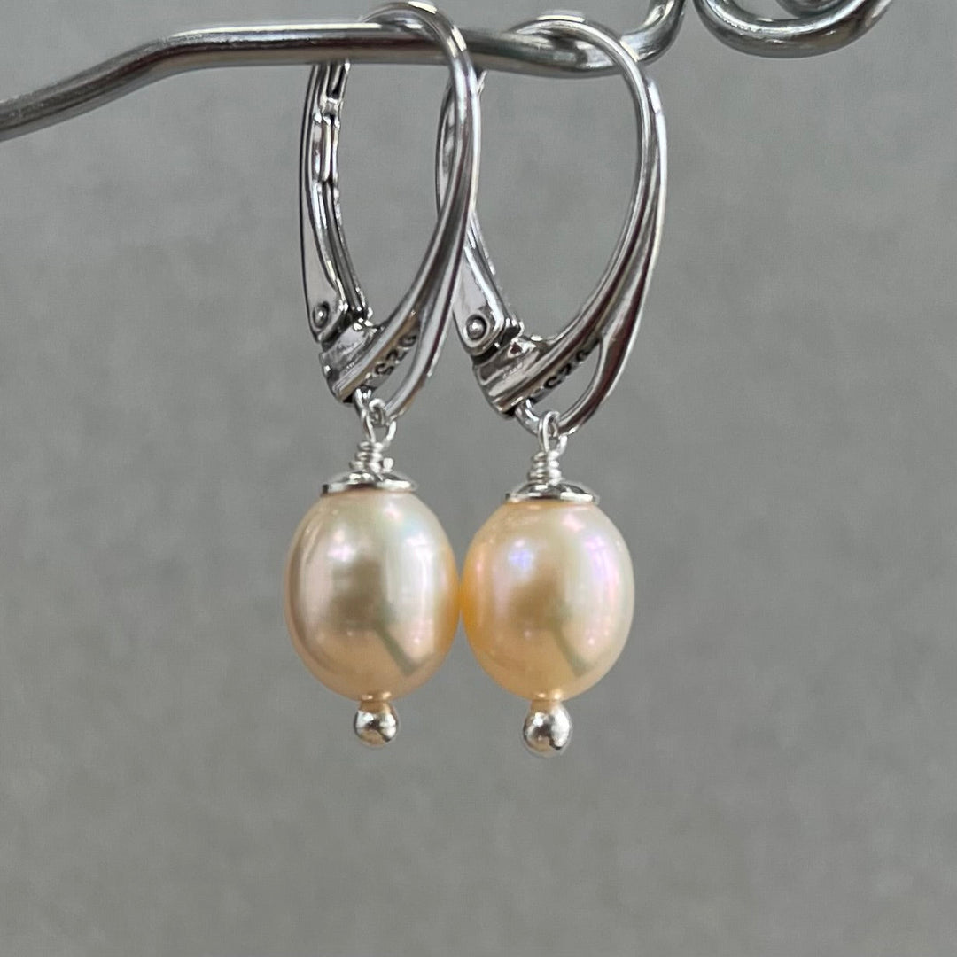 Earrings with pearls, light pink color, in silver