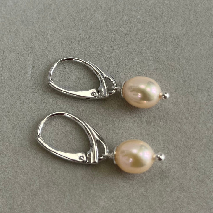 Earrings with pearls, light pink color, in silver