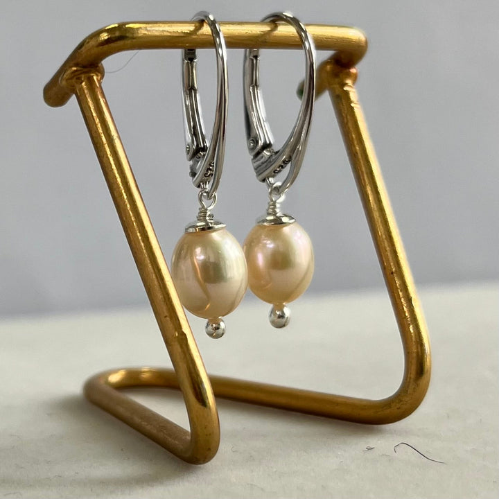 Earrings with pearls, light pink color, in silver