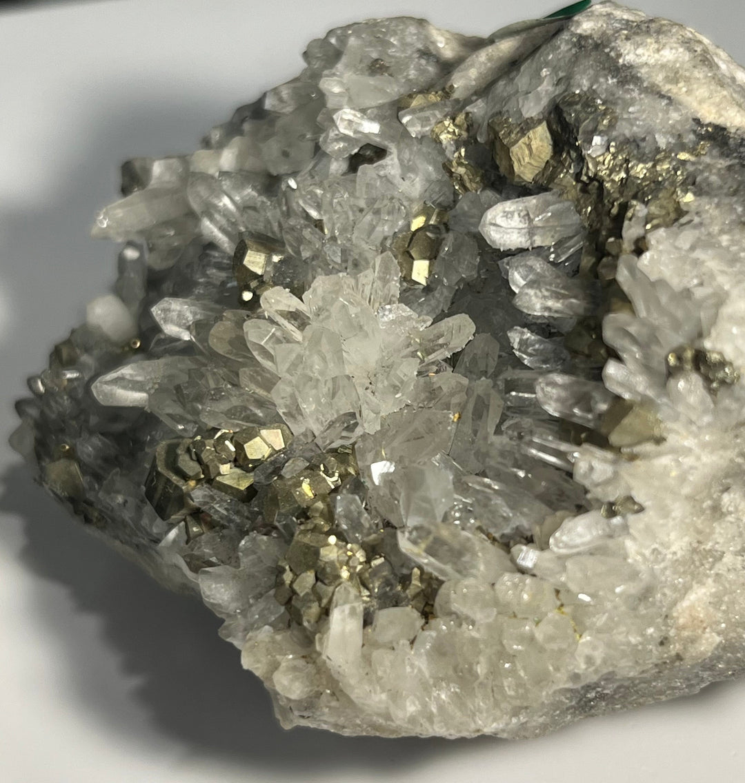 Pyrite on rock crystal, Romania DB64