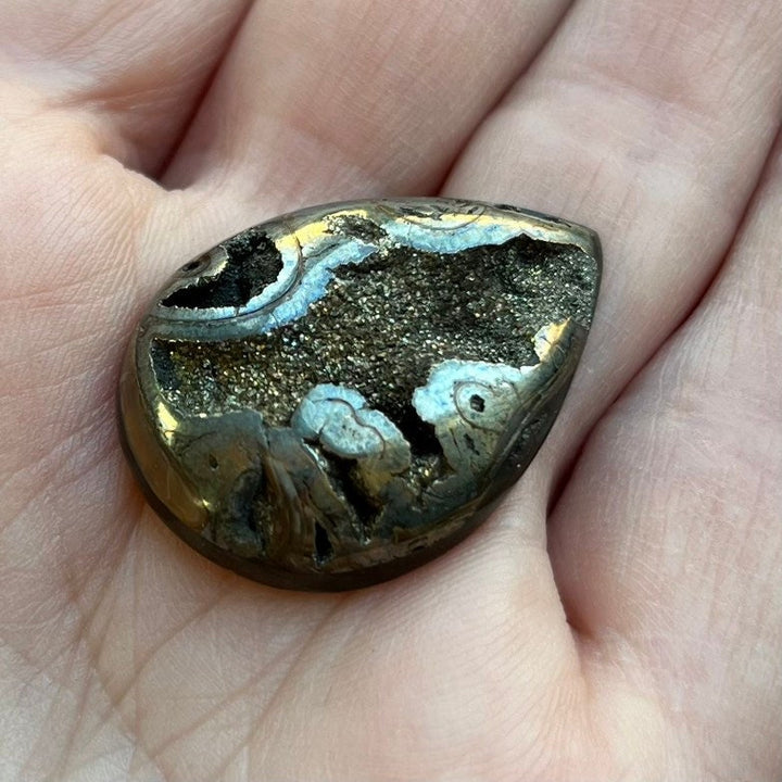 Pyritized ammonite, AM_P105, cabochon cut, 29x21x6 mm; 5.7g