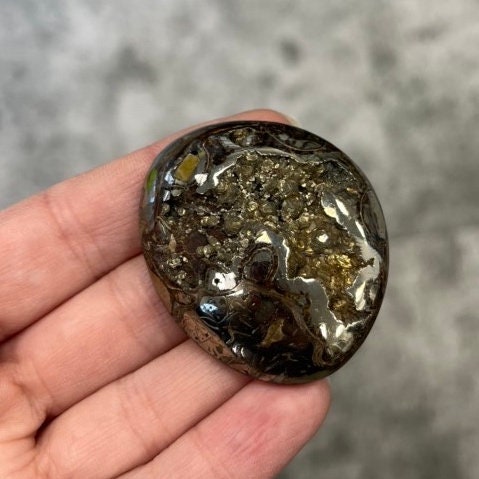 Pyritized ammonite, AM_P067, cabochon cut, 47x39x11mm; 29.3g;