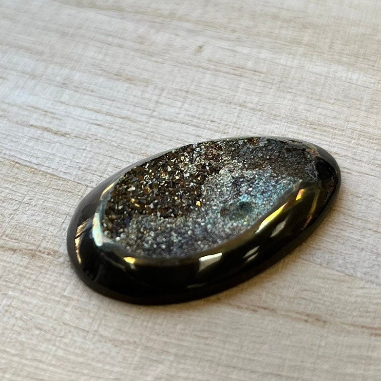 Pyritized ammonite, AM_P100, cabochon cut, 34x20x6 mm; 5.8g