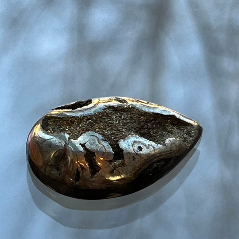 Pyritized ammonite, AM_P105, cabochon cut, 29x21x6 mm; 5.7g