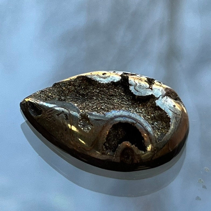 Pyritized ammonite, AM_P105, cabochon cut, 29x21x6 mm; 5.7g