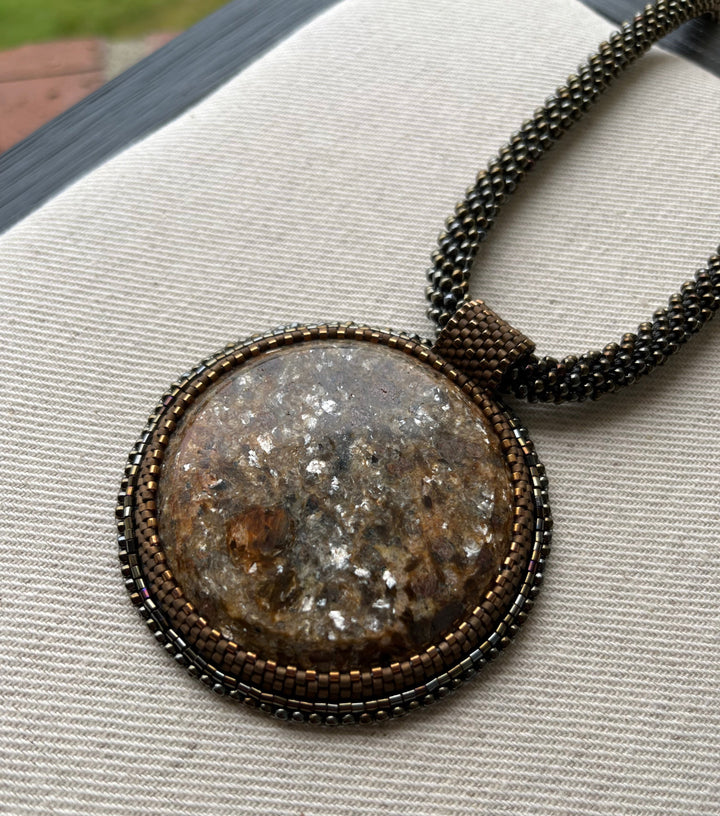 Embroidered necklace with micaschist (mica and garnet)