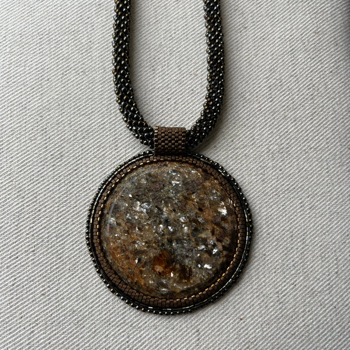 Embroidered necklace with micaschist (mica and garnet)