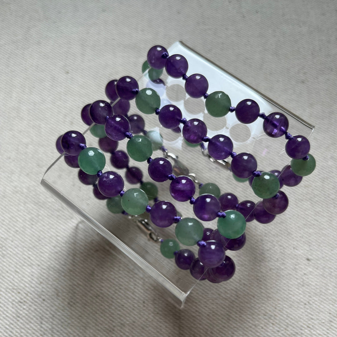Knotted bracelet made of natural stones (amethyst, green aventurine) with a silver clasp