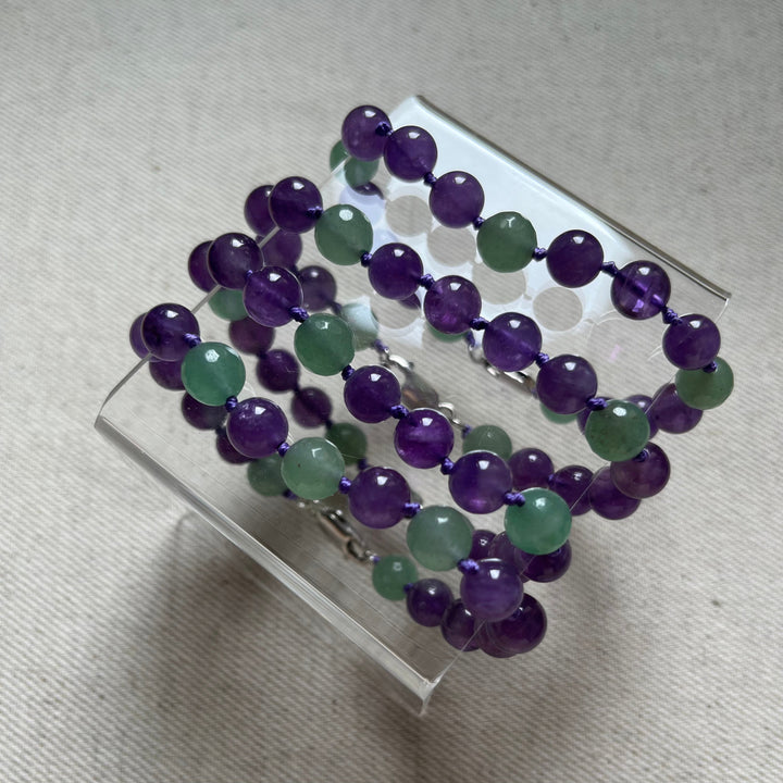 Knotted bracelet made of natural stones (amethyst, green aventurine) with a silver clasp